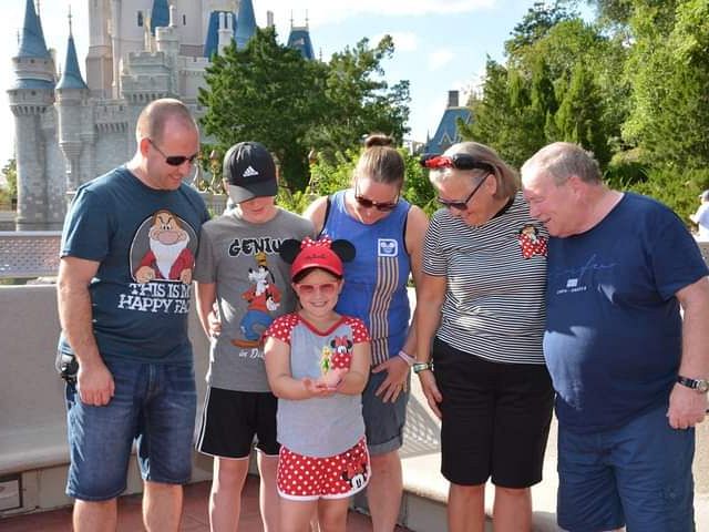 Andrea with her family at Disneyworld, Florida