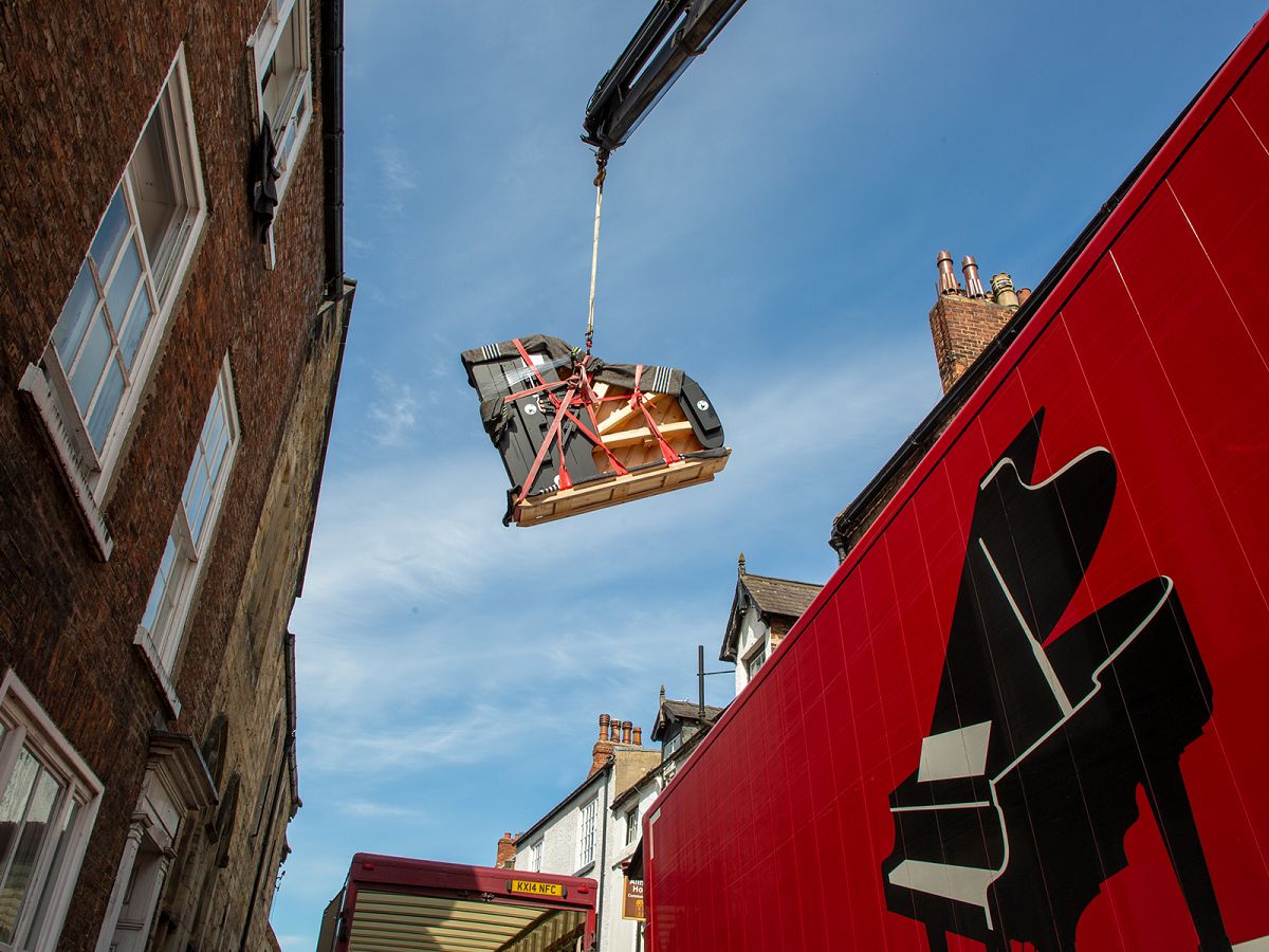 A sense of nervous anticipation - 23 pianos were delivered to their new homes using long-reach cranes to lift them carefully through windows.