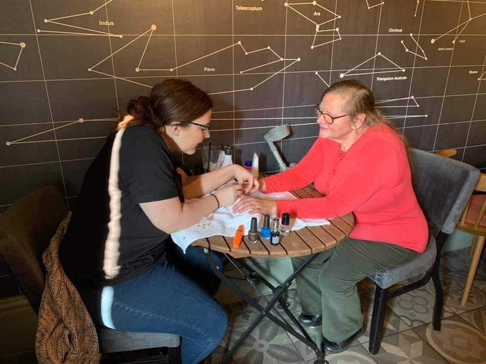 One of the Buddy_Cups attendees getting a manicure during one of the meet-ups